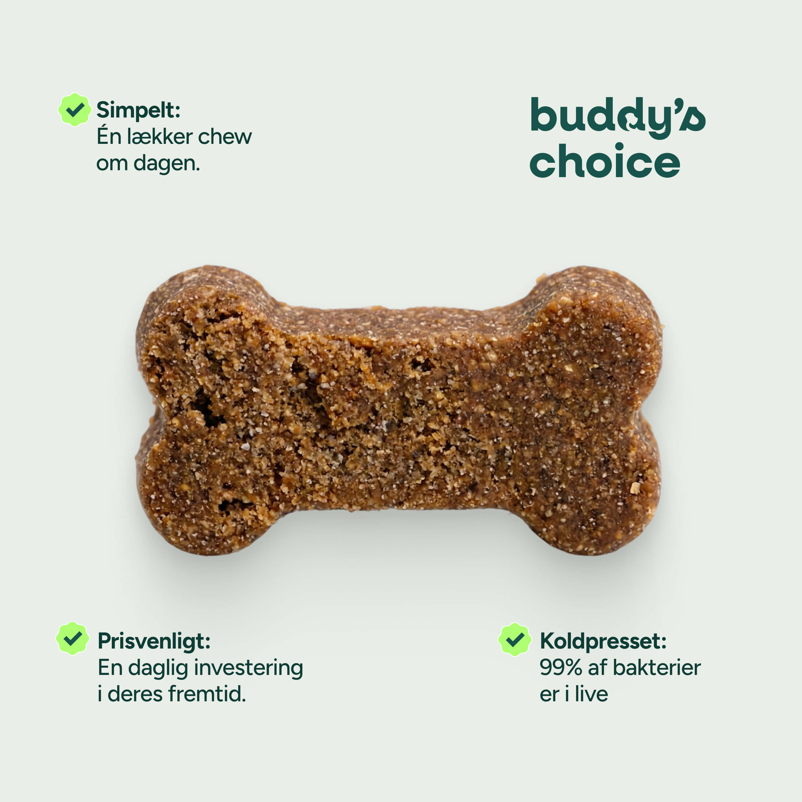 Brunt koldpresset hundegodbid formet som knogle med buddy's choice-logo på lys baggrund